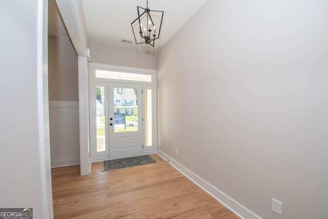 69 Oakhurst Trl, Sharpsburg, GA 30277 - foyer entrance featuring a chandelier and light wood-type flooring