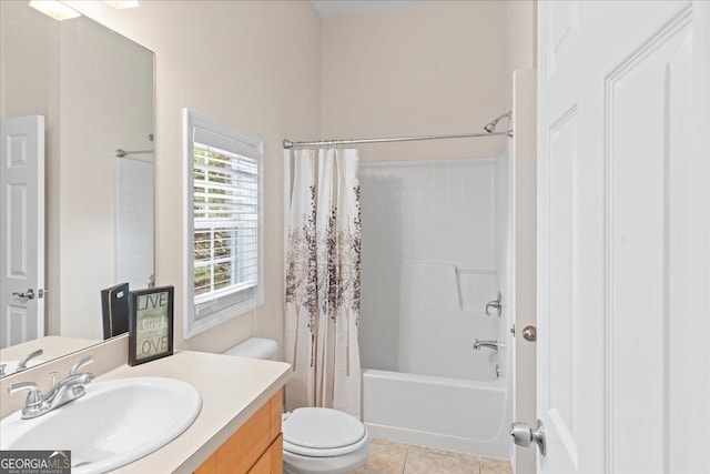 full bathroom featuring shower / bath combination with curtain, vanity, tile patterned floors, and toilet