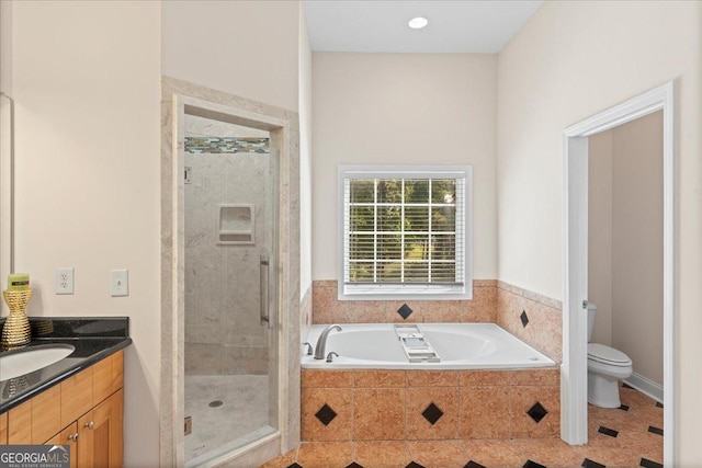 full bathroom featuring plus walk in shower, vanity, tile patterned floors, and toilet