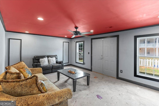 living room featuring crown molding and ceiling fan