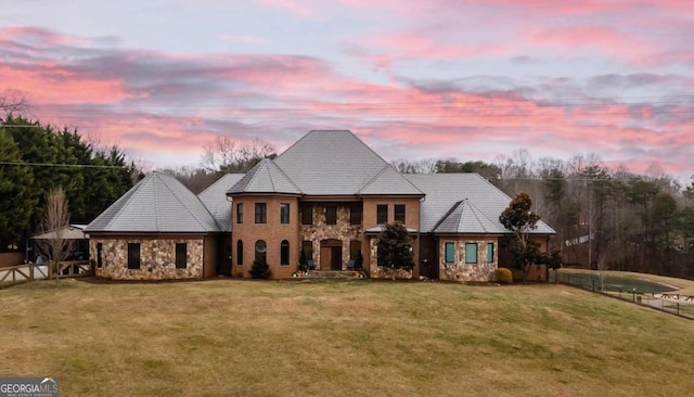 view of front of home with a lawn