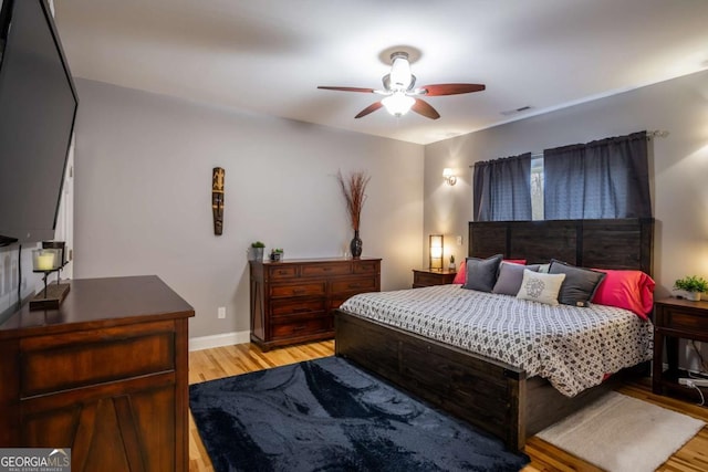 bedroom featuring ceiling fan and light hardwood / wood-style flooring