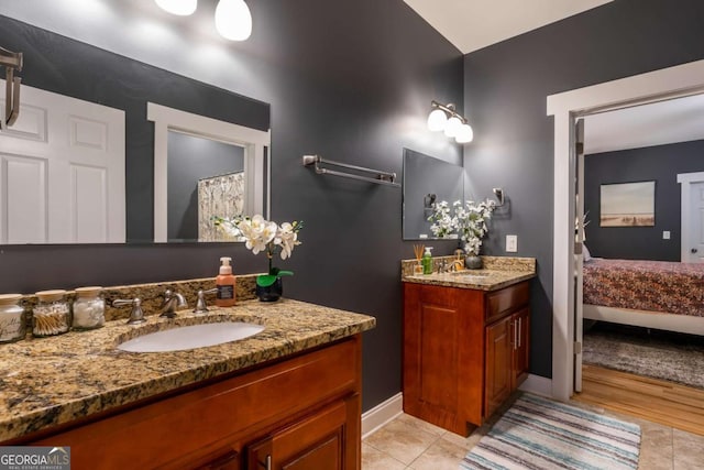 bathroom featuring tile patterned flooring and vanity