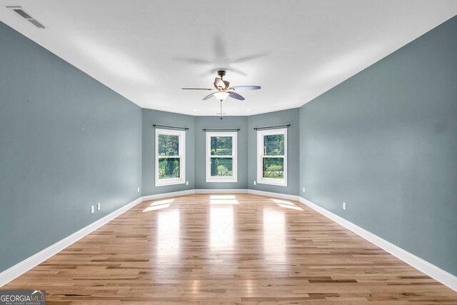 1580 Loving Rd, Morganton, GA 30560 - unfurnished room featuring a ceiling fan, light wood-style flooring, and visible vents