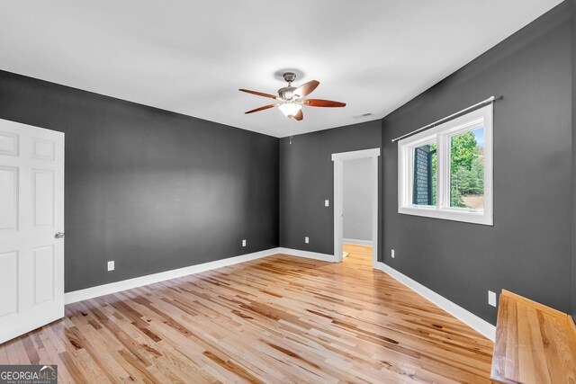 1580 Loving Rd, Morganton, GA 30560 - spare room with light wood-style floors, a ceiling fan, and baseboards