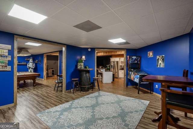 playroom with pool table, hardwood / wood-style floors, and a drop ceiling