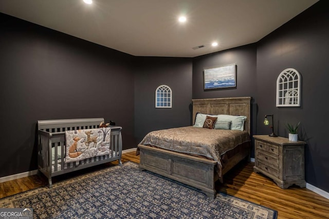 bedroom with wood-type flooring