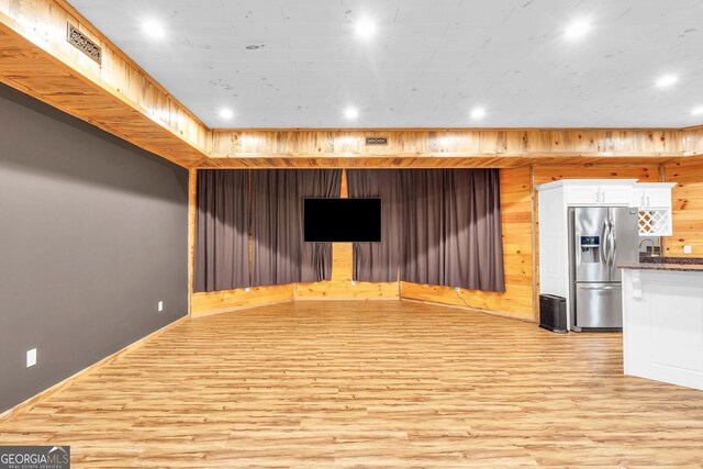 1580 Loving Rd, Morganton, GA 30560 - interior space with stainless steel refrigerator with ice dispenser, recessed lighting, light wood-style floors, and wood walls