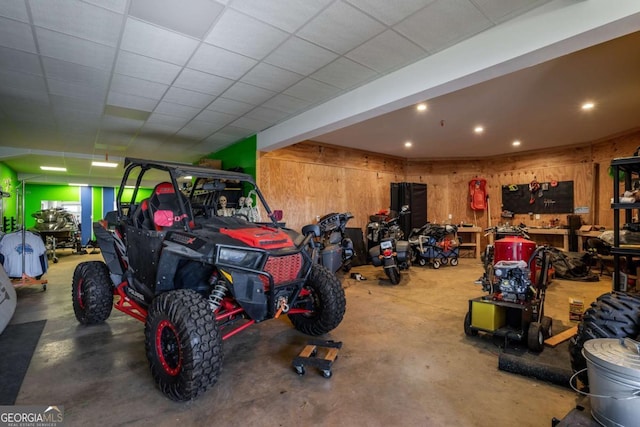 garage featuring wooden walls