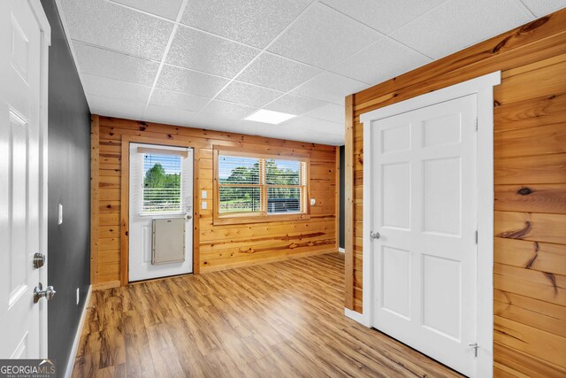 1580 Loving Rd, Morganton, GA 30560 - entrance foyer featuring light wood-style floors, baseboards, a drop ceiling, and wooden walls
