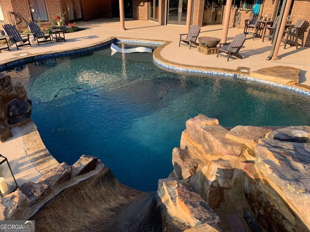 view of pool featuring a patio area