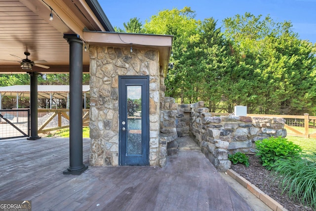 1580 Loving Rd, Morganton, GA 30560 - property entrance with fence, stone siding, and a deck