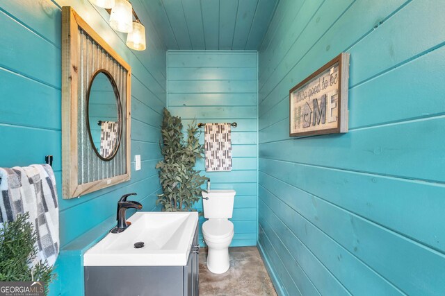 1580 Loving Rd, Morganton, GA 30560 - bathroom with wooden walls, wood ceiling, vanity, and toilet