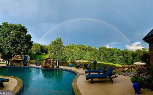 view of pool featuring a patio area