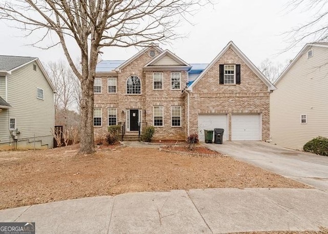 view of front of property featuring a garage