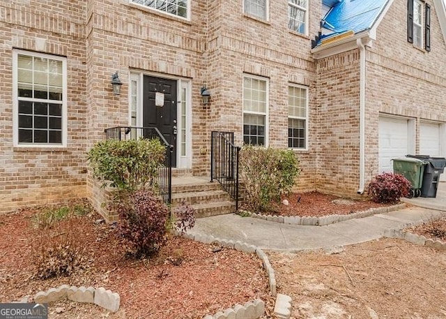 property entrance with a garage