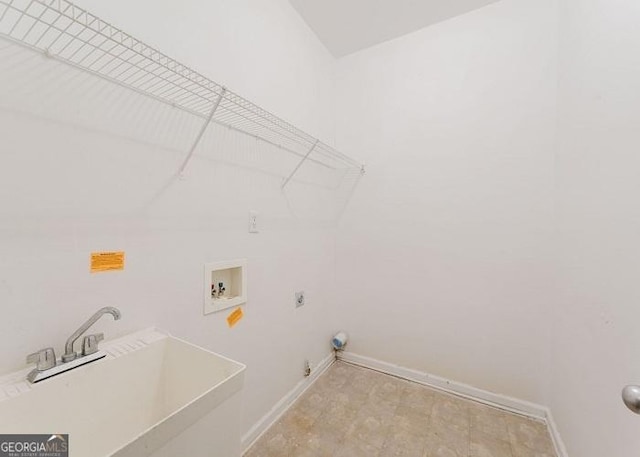 clothes washing area with hookup for a gas dryer, hookup for an electric dryer, sink, and washer hookup