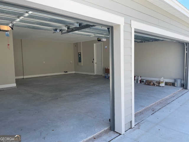 garage featuring a garage door opener and electric panel