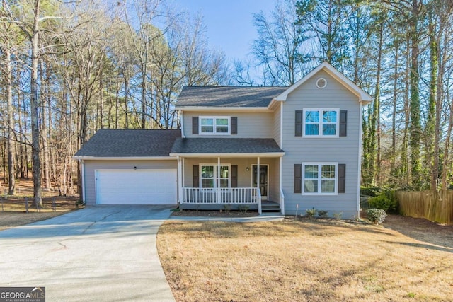 front facade with a garage, a front yard, and covered porch