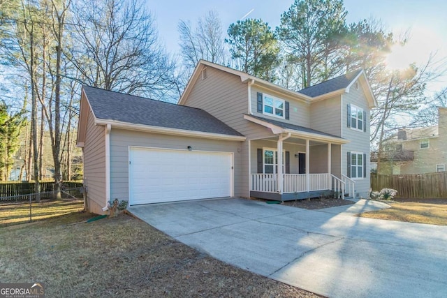 view of front of home featuring a porch and a garage