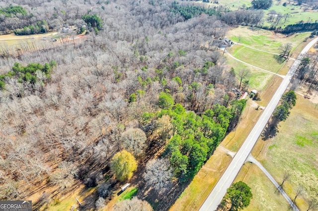 birds eye view of property featuring a rural view