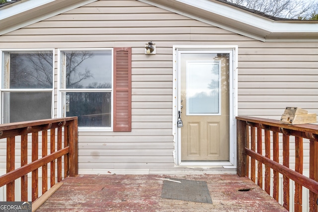 property entrance with a deck