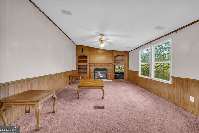 living room featuring ceiling fan and carpet floors