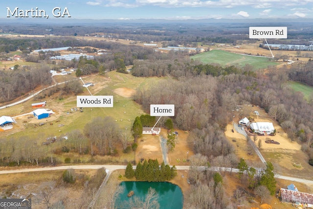 aerial view featuring a water view and a rural view