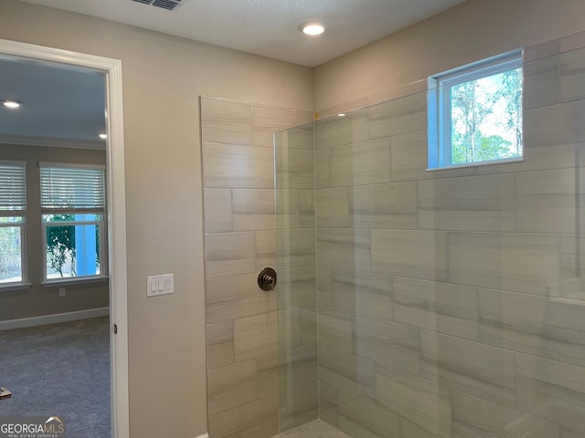 bathroom featuring a tile shower