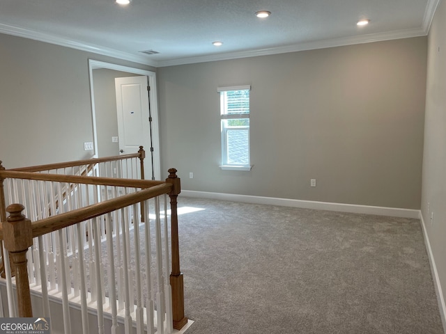 carpeted spare room with ornamental molding