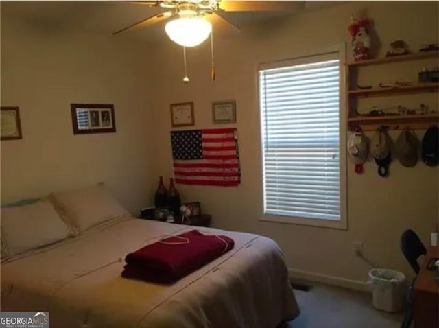 carpeted bedroom with ceiling fan