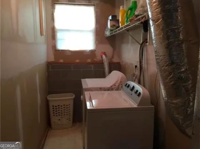 laundry area with washing machine and dryer