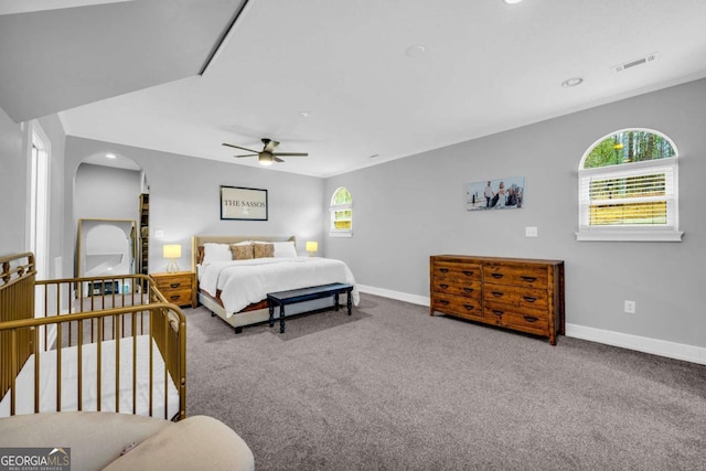 bedroom with multiple windows, carpet flooring, and ceiling fan