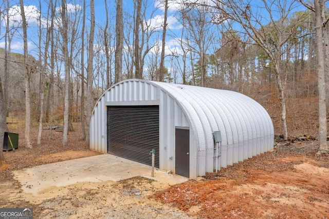 view of outbuilding featuring a garage