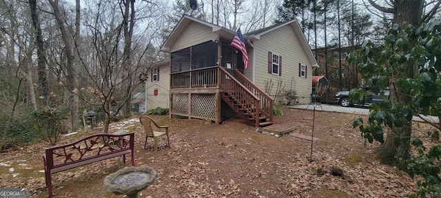 exterior space featuring a sunroom