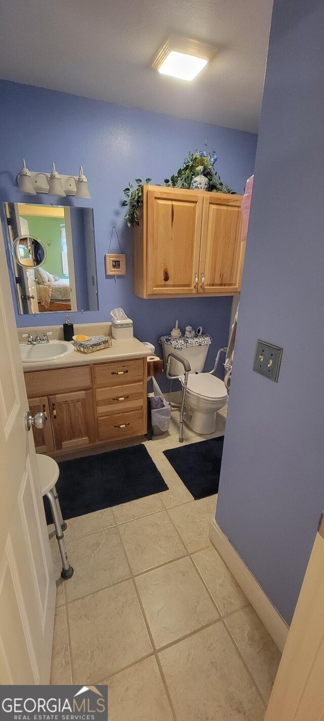 bathroom featuring sink and tile patterned flooring