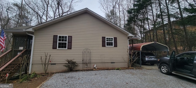 view of property exterior with a carport