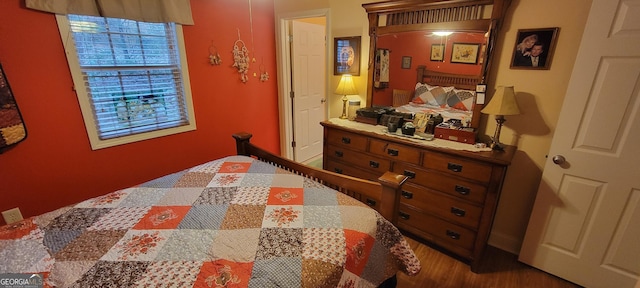 bedroom with hardwood / wood-style floors