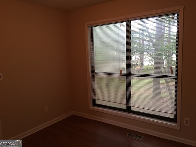 spare room featuring hardwood / wood-style flooring