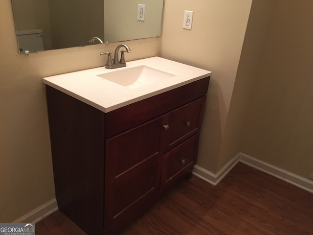 bathroom with vanity and hardwood / wood-style floors