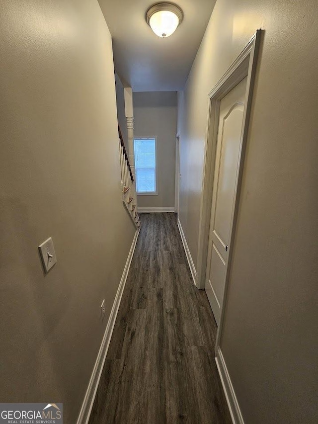 hallway featuring dark wood-type flooring