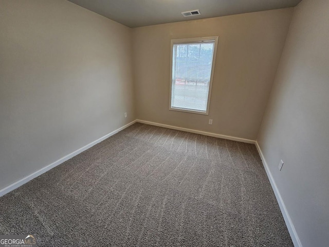 spare room featuring carpet flooring