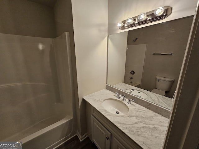 full bathroom featuring shower / washtub combination, vanity, and toilet