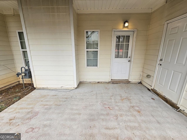 property entrance with a patio