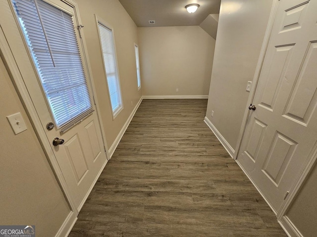 corridor with dark hardwood / wood-style floors