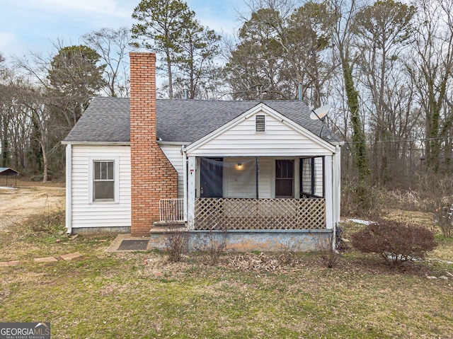 view of front of property with a front yard and a porch