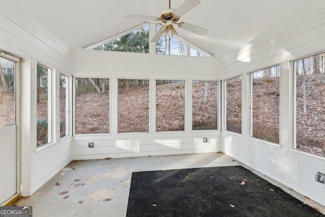 unfurnished sunroom with lofted ceiling, a healthy amount of sunlight, and a ceiling fan