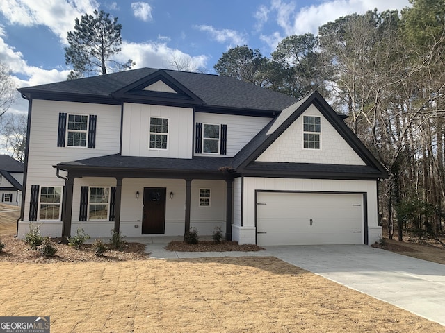 view of front of property with a garage and covered porch