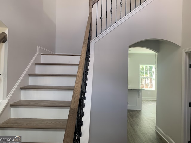 stairs featuring wood-type flooring