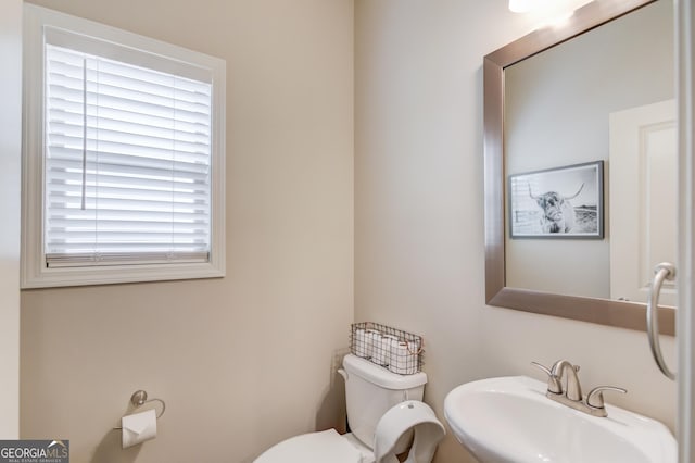 bathroom with toilet and sink